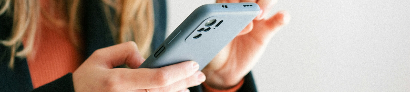 woman using mobile phone to do banking